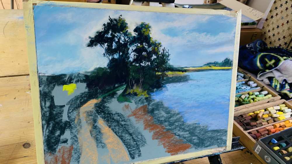 Pastel painting on an easel, showing underpainting stage.