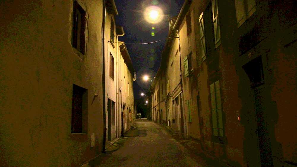 Narrow street in France, at night.